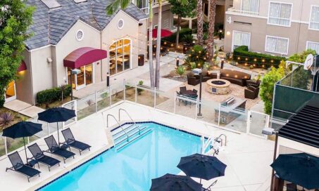 A Sonesta ES Suites property exterior with a pool